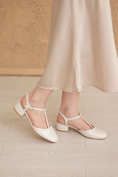 Malorie Tbar Heels in Cream Patent